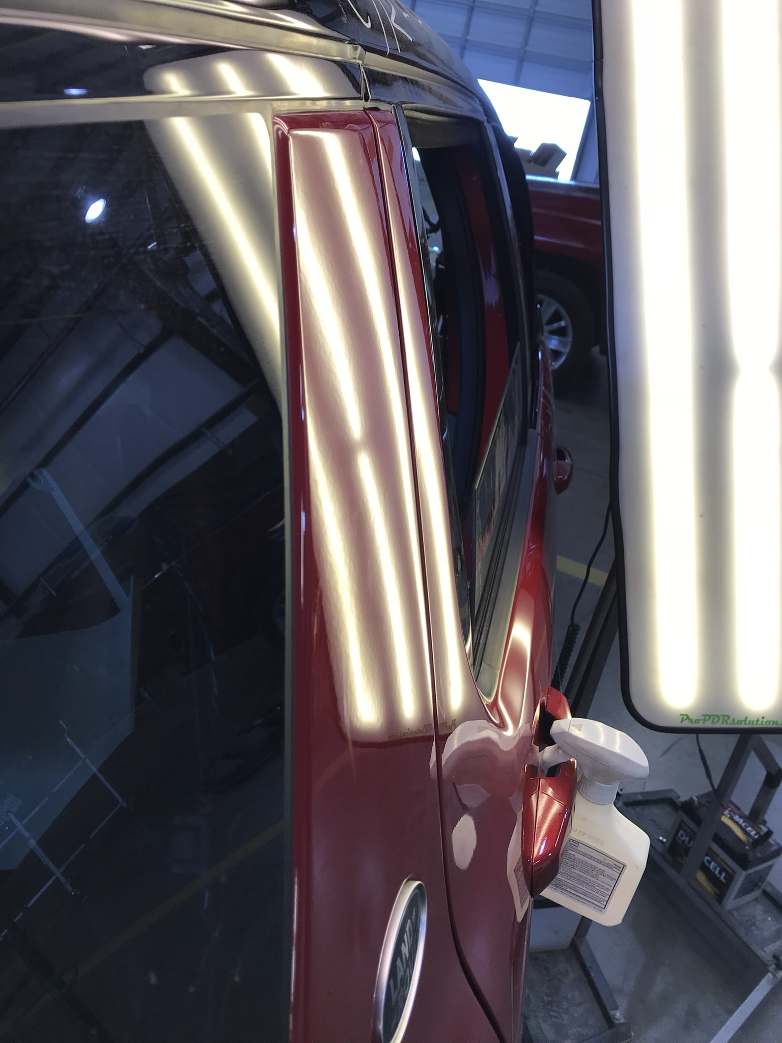 Red SUV pillar after repair