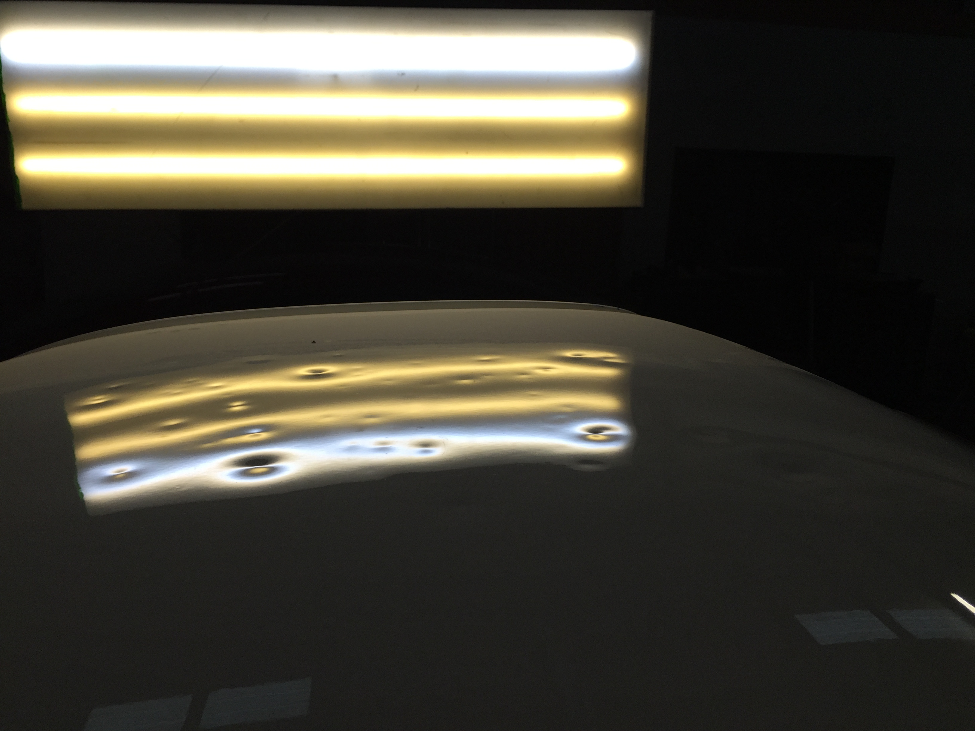 White roof hail damage before repair